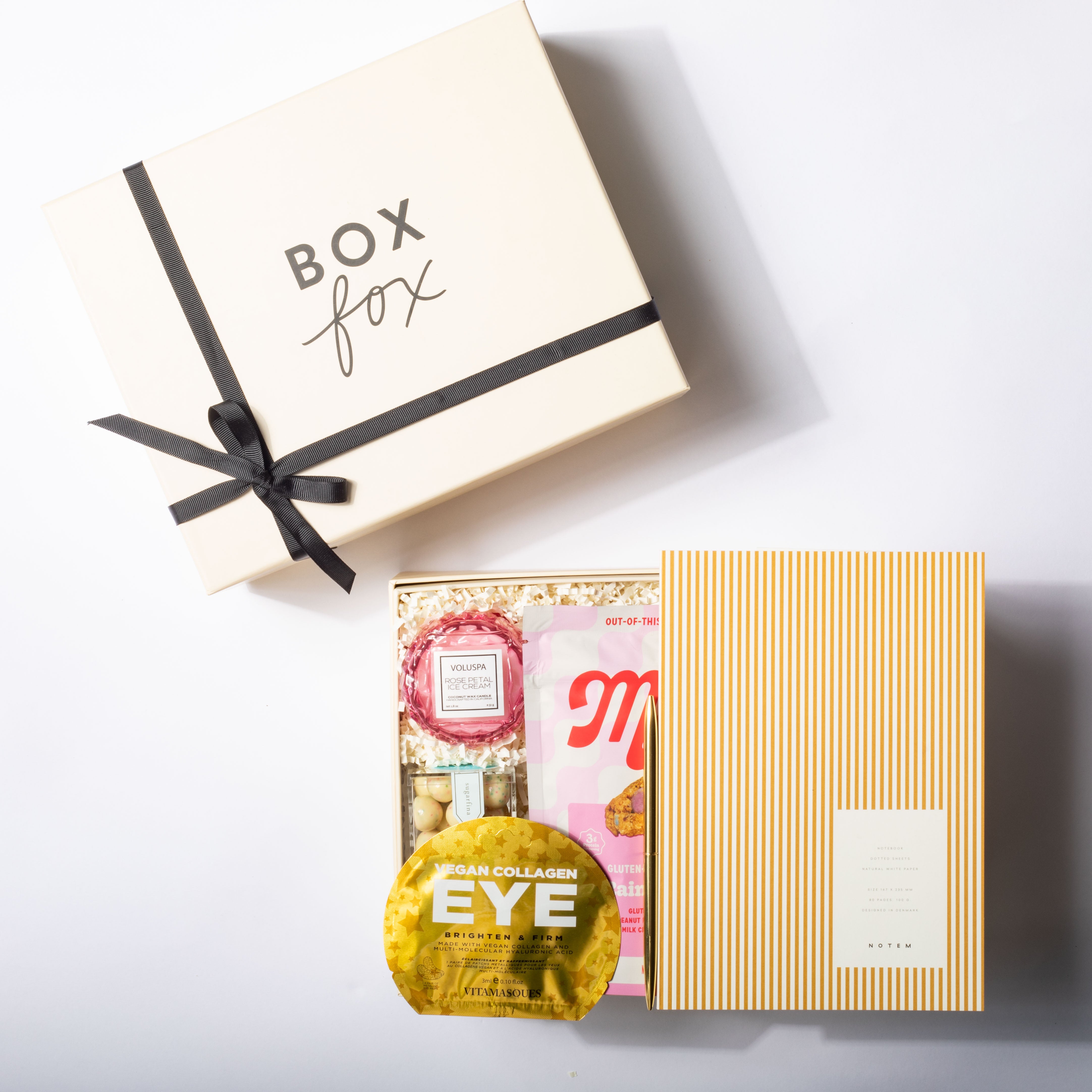 Gift box with 'Box Fox' branding, containing skincare products on a white background