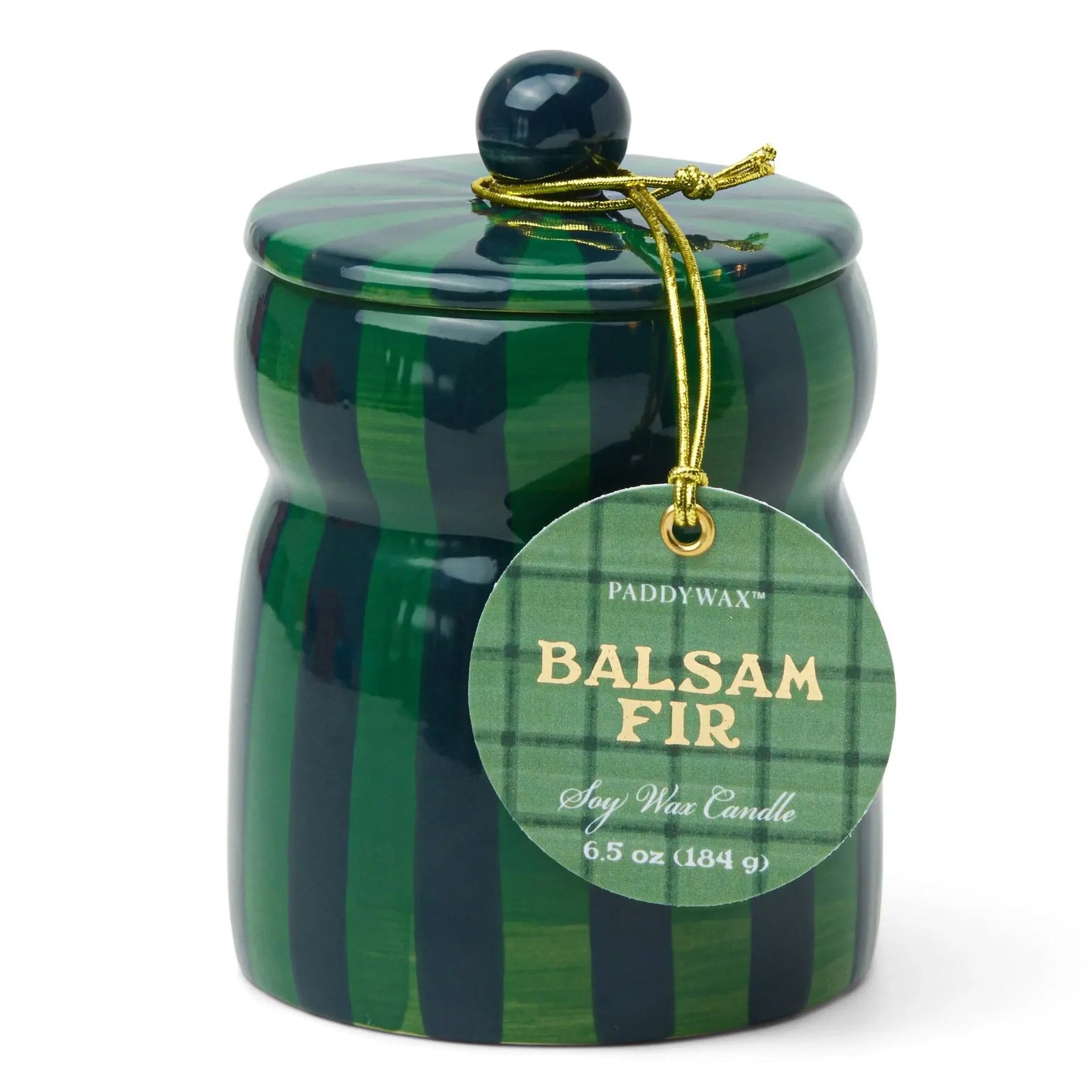 green and blue striped candle with a tag that says balsam fir
