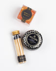 CHAMPAGNE TOAST CURATED BOX ITEMS DISPLAYED: Champagne Bears, Crisp Champagne Mini Tin Candle, and Black Match Jar