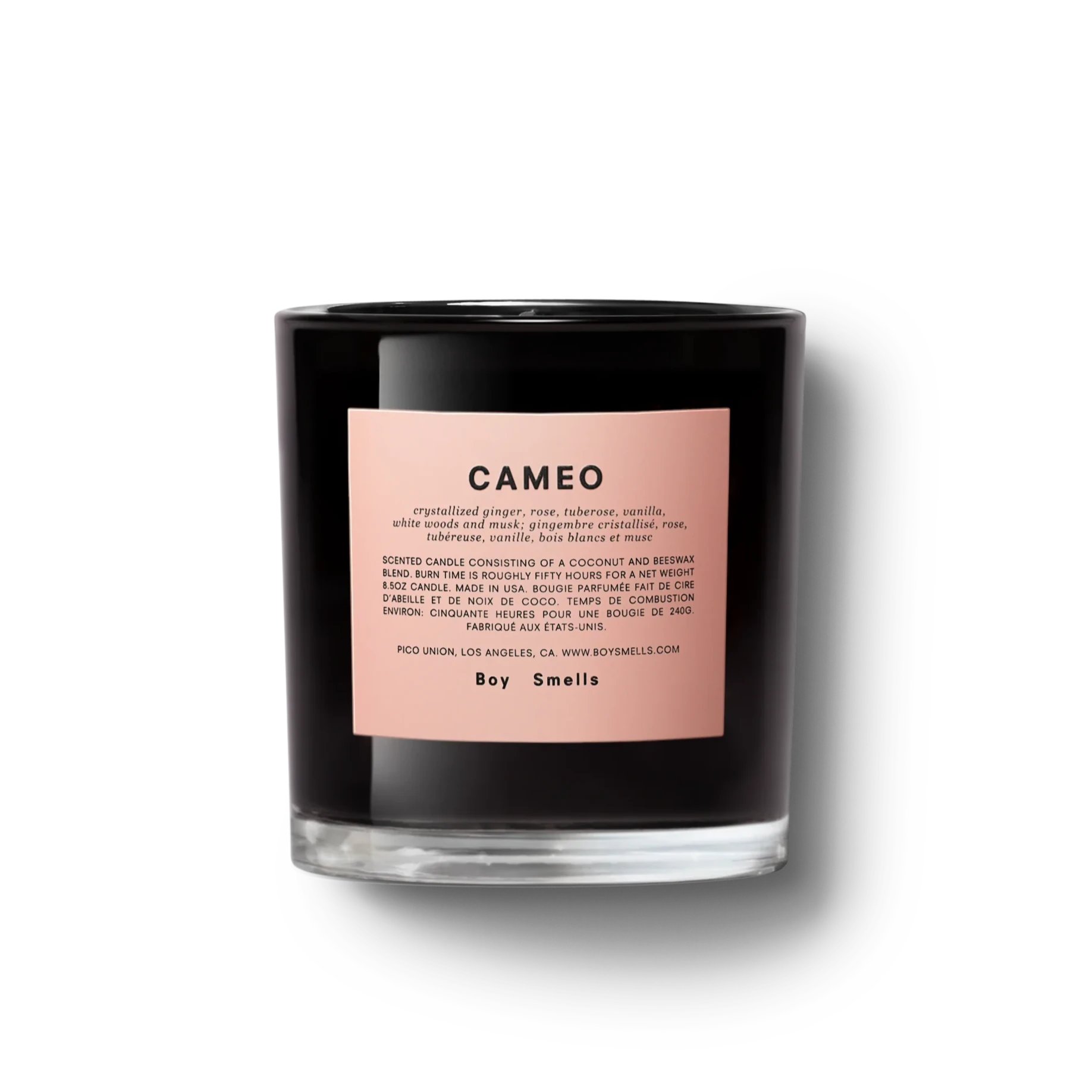glossy black glass candle with pink label in the front. label has black text 