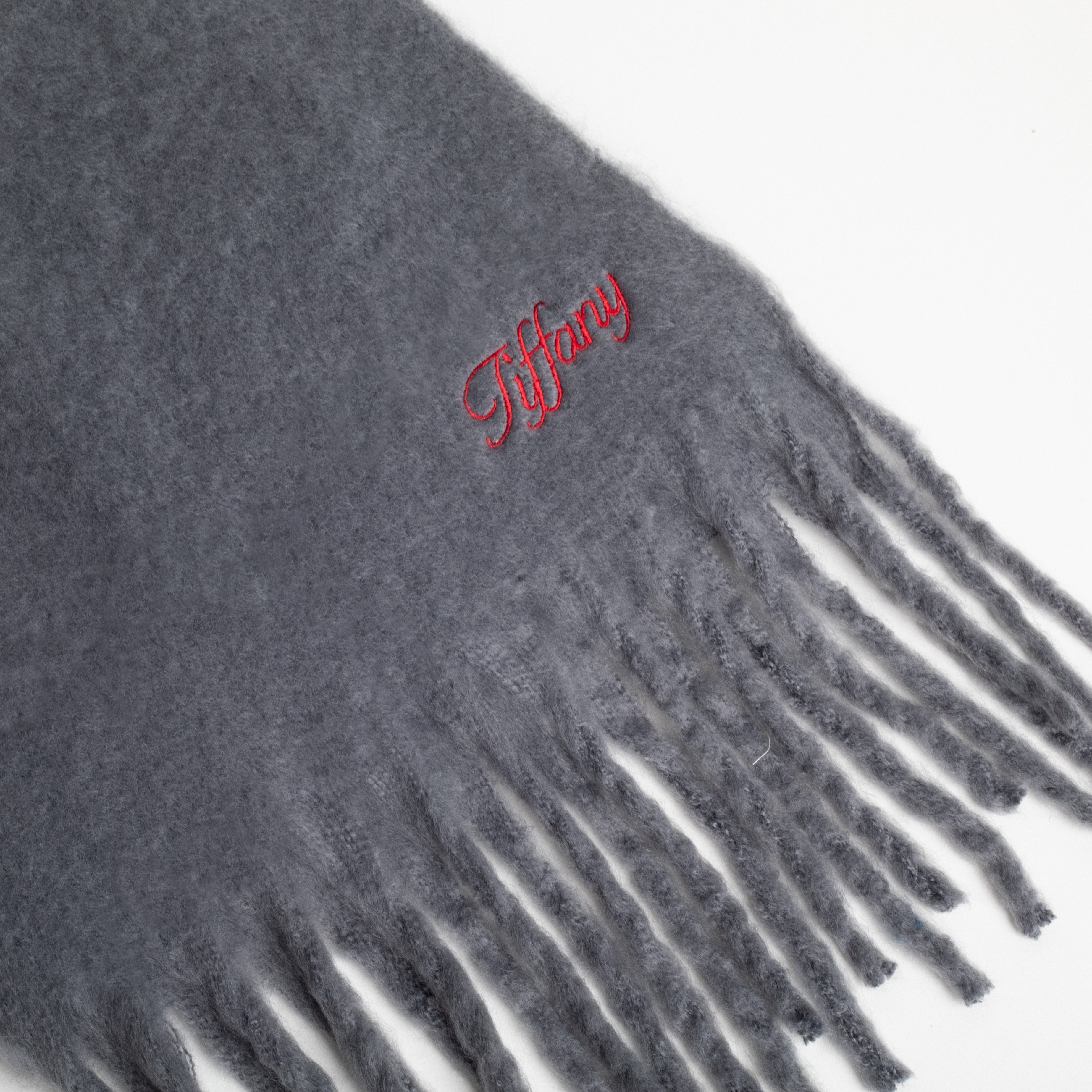 Gray scarf with red 'Tiffany' logo on a white background