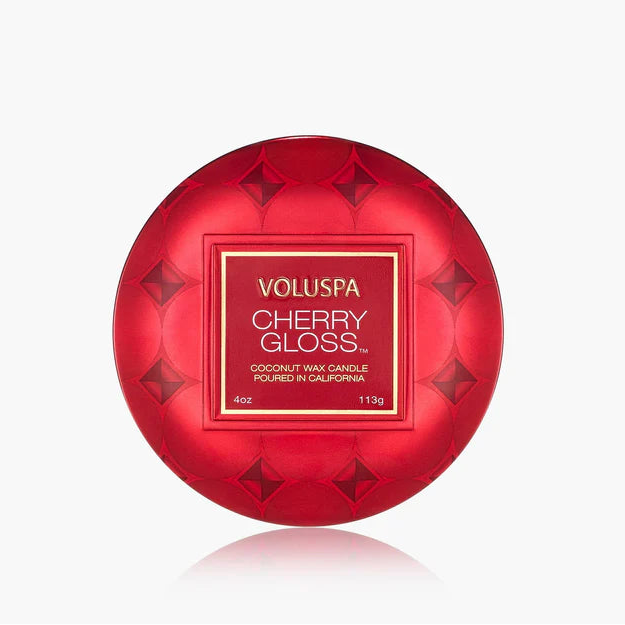 Red Voluspa Cherry Gloss candle on a white background