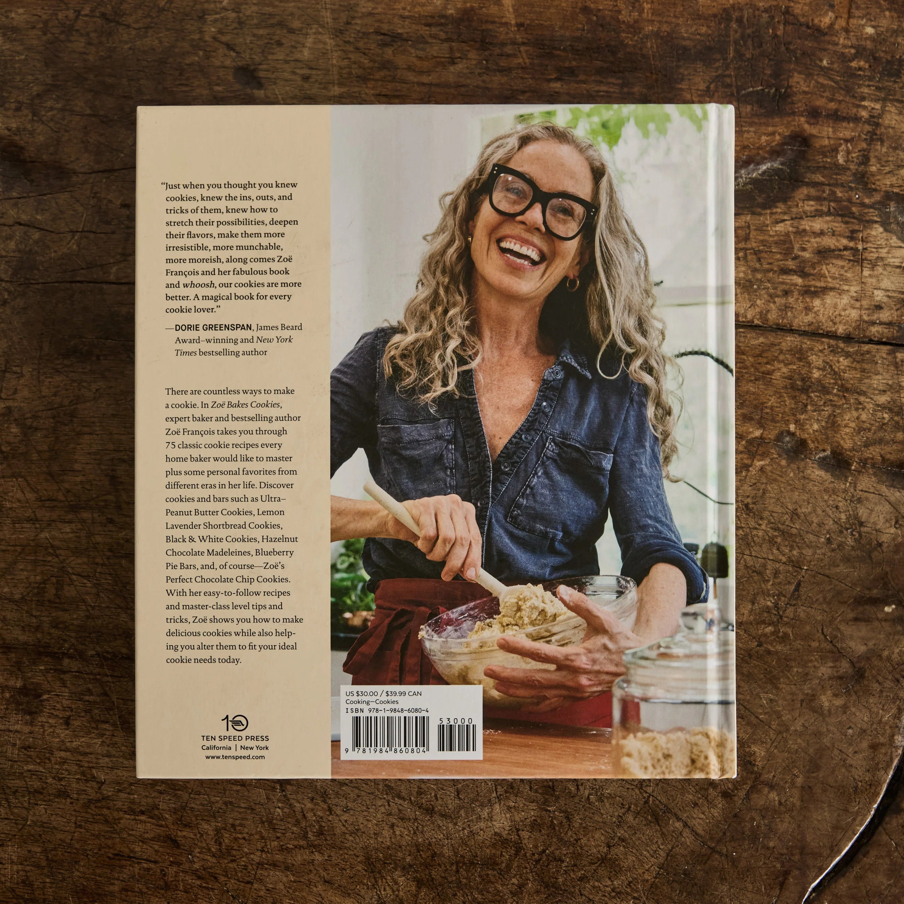 Book cover with a person on a wooden surface