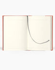 notebook spread open showing white lined paged with bookmark