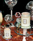 Sparkling Cuvée Medium Glass Jar Candle next to champagne coupes and sparky things