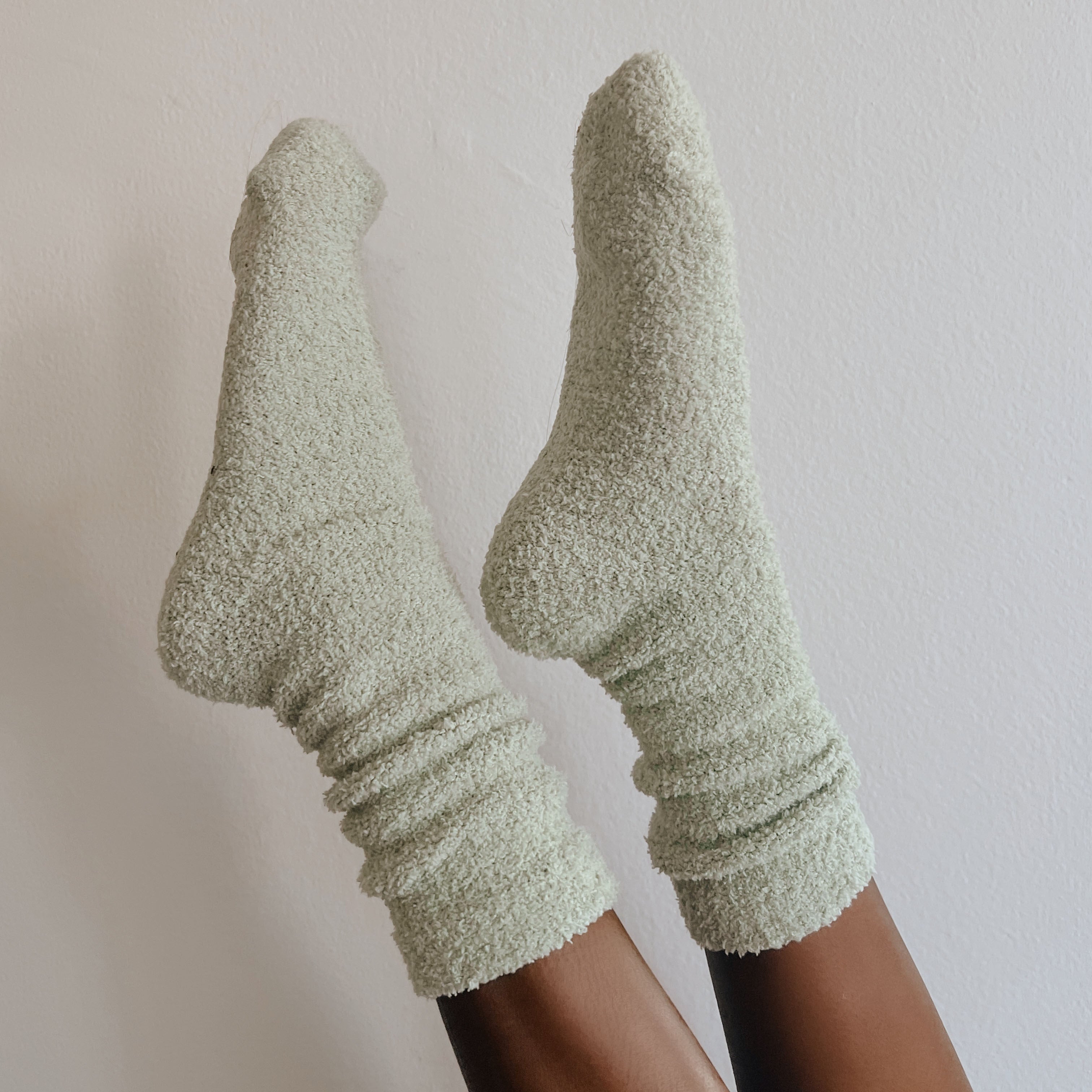 girl wearing green socks in air