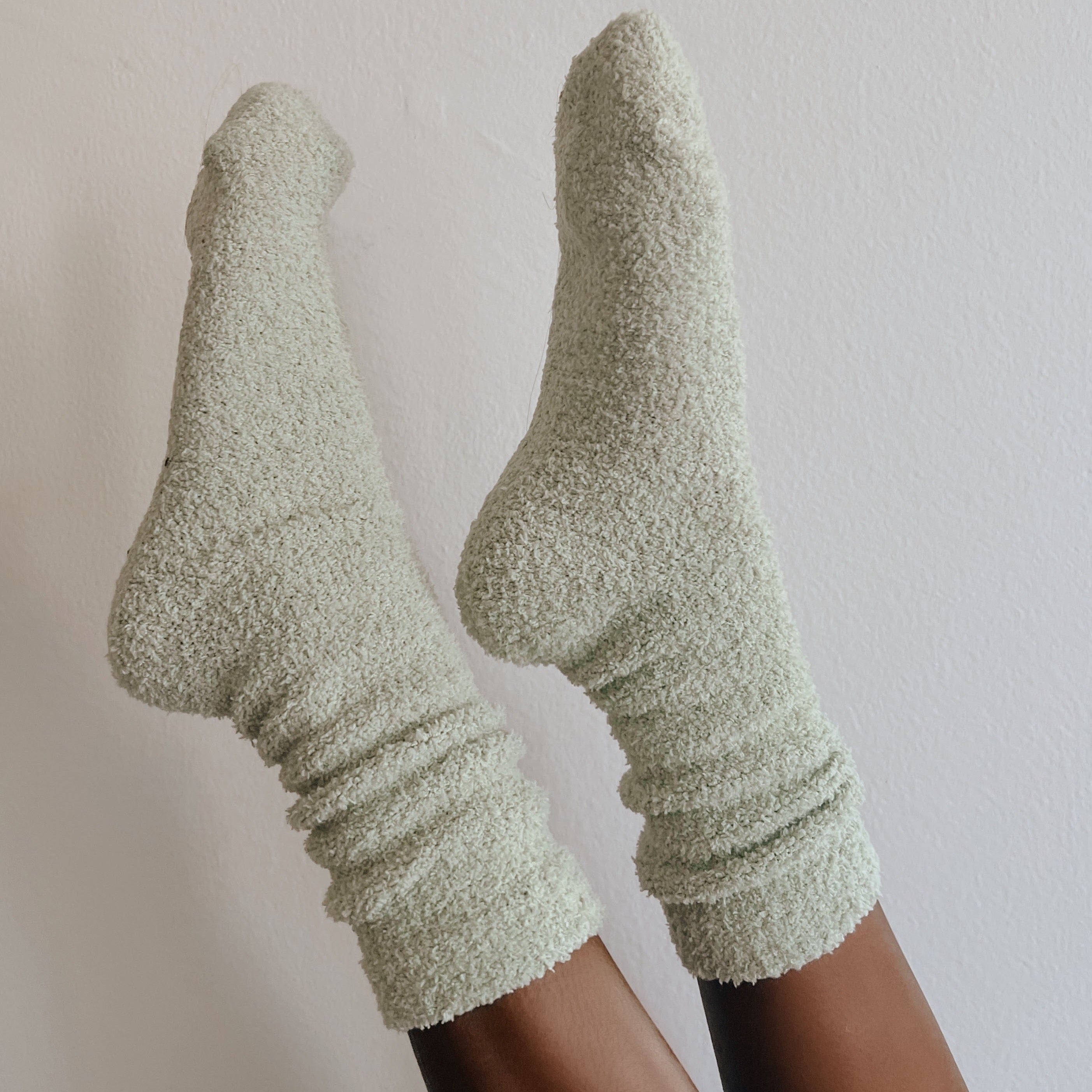 girl wearing green socks in air