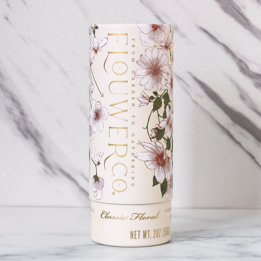 Flowerco skincare product tube on a marble background