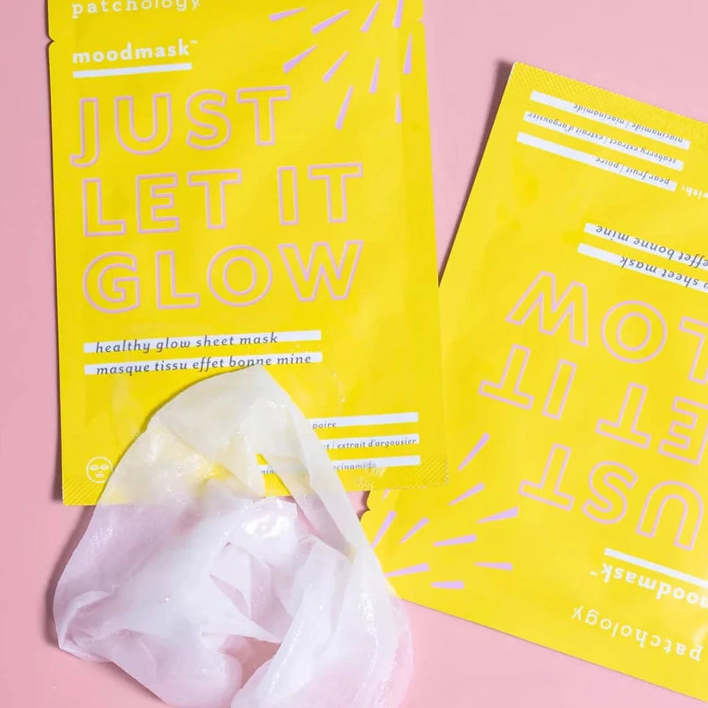 yellow sheet mask packaging with sheet mask on the bottom