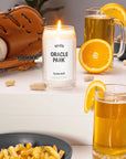 Oracle Park Candle surrounded by baseball and glove, pints of beer, fries and peanuts