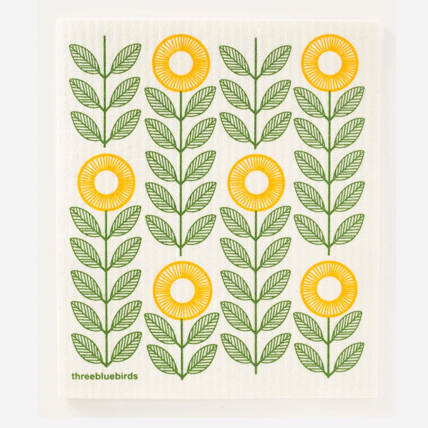 swedish dishcloth with yellow sunflowers printed on it. sunflowers have green leaves printed on it