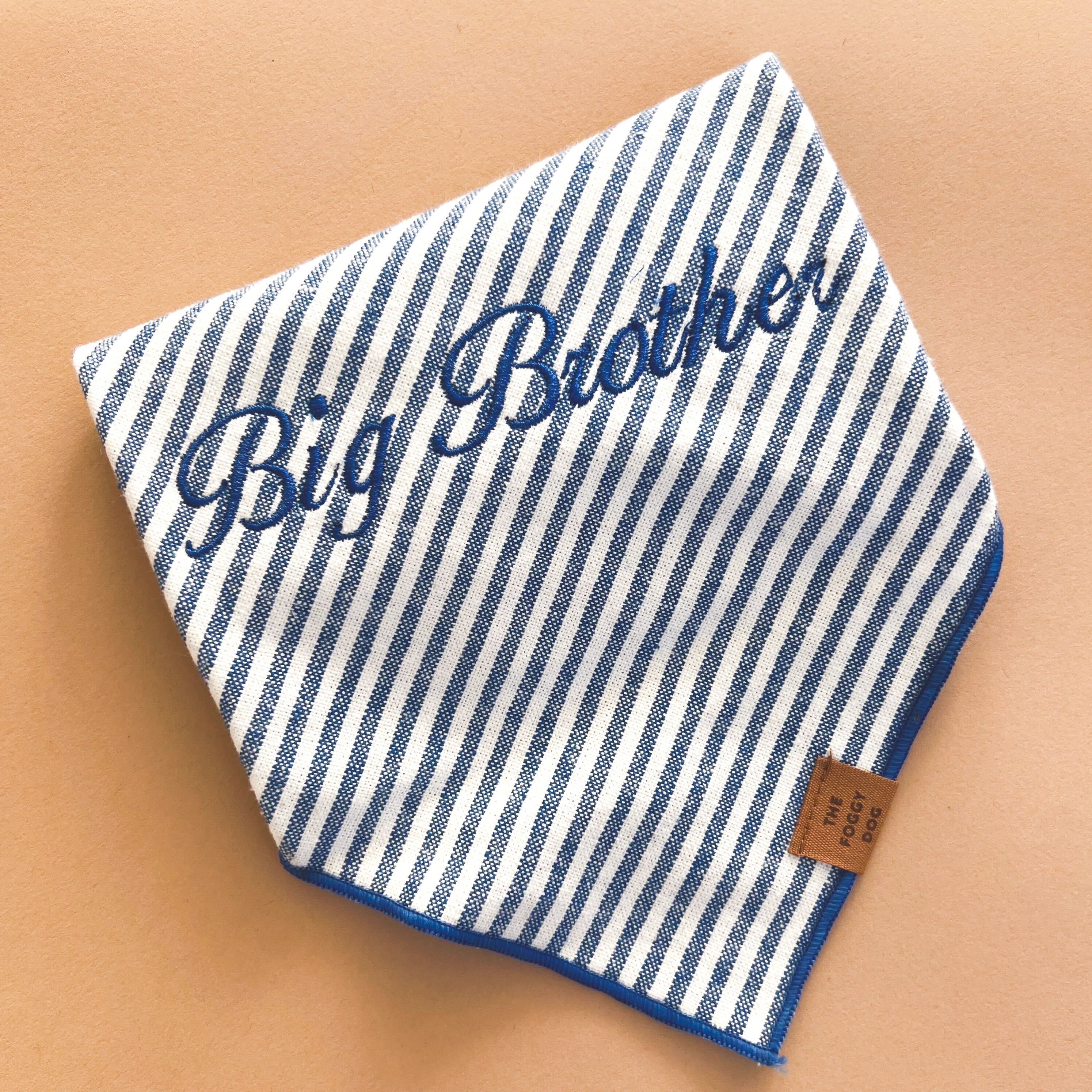 blue and white striped dog bandana with embroidered text
