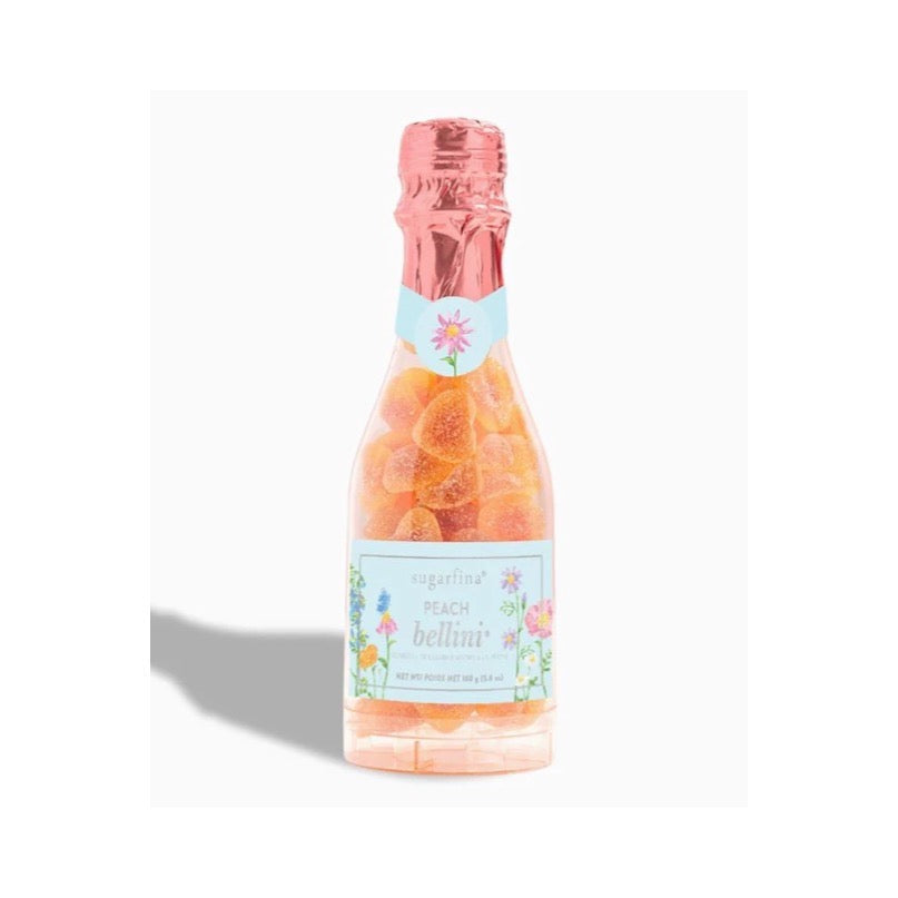 light blue floral label on bottle with rose gold pink foil at the top. clear plastic bottle with heart shaped gummies inside 