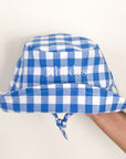 embodied gingham blue and white hat. embroidered text is in white 