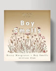 cube box with boy smells printed in white and floral illsurations on the bottom 