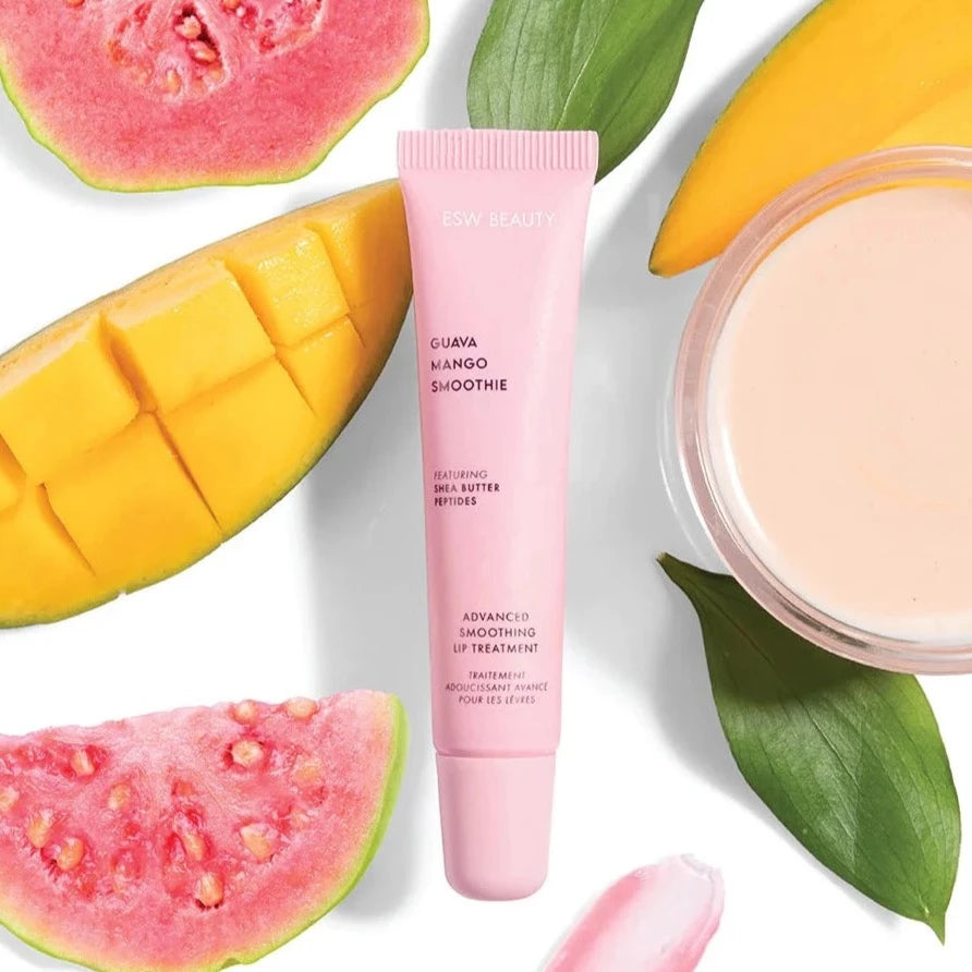 pink lip balm tube with guava and mango surrounding it 