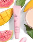 pink lip balm tube with guava and mango surrounding it 