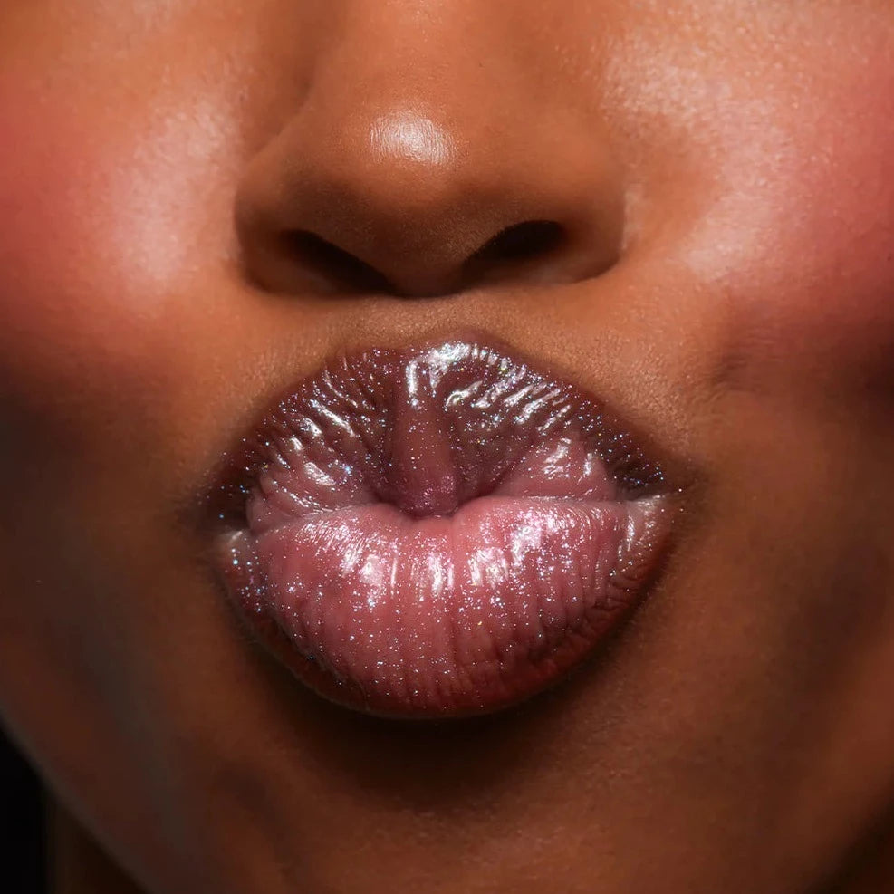 Girl wears Lust + Found Glossy Lip Lacquer in Billie on lips