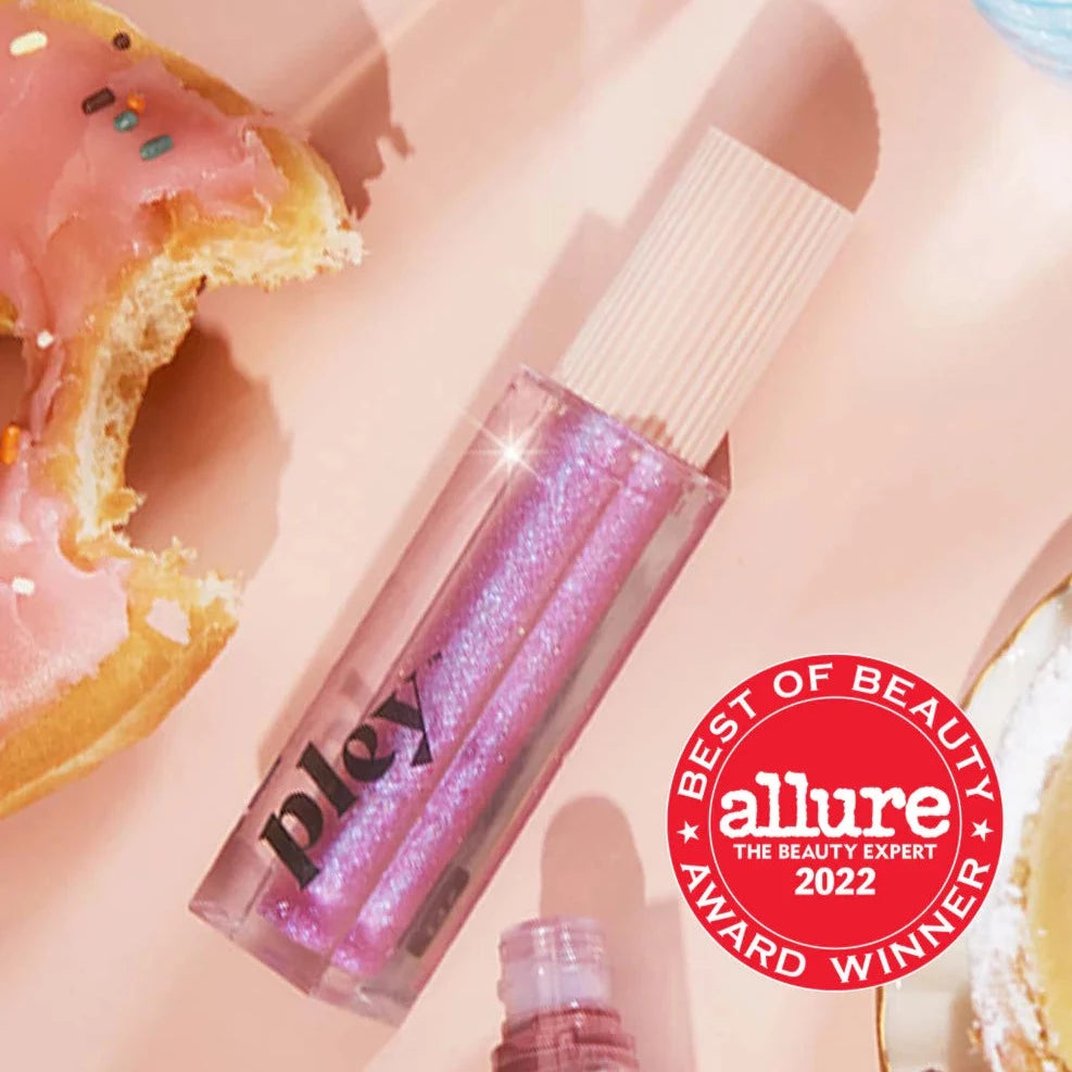 Lust + Found Glossy Lip Lacquer next to donut 