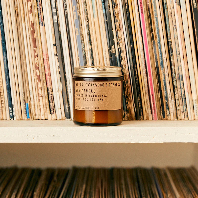 Mini Teakwood & Tobacco 3.5 oz Soy Candle in front of records