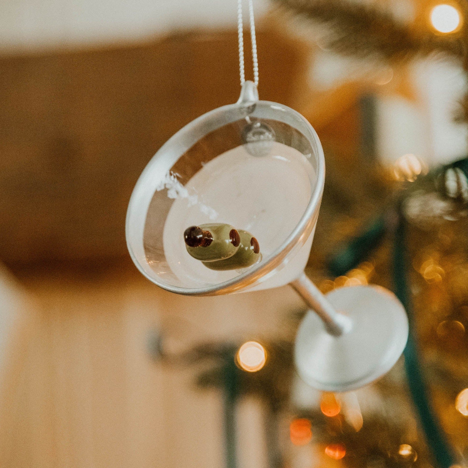 Martini Glass Ornament in Front of Tree