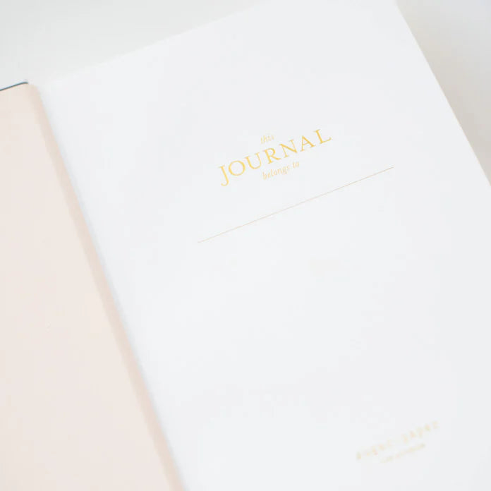 Journal with 'The Journal' branding on a light background