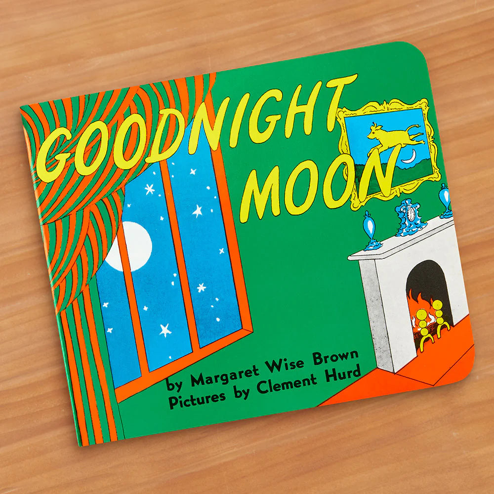 goodnight moon written in yellow text. the book is colorful with green, blue, orange, red, yellow. There is a window that shows the white moon