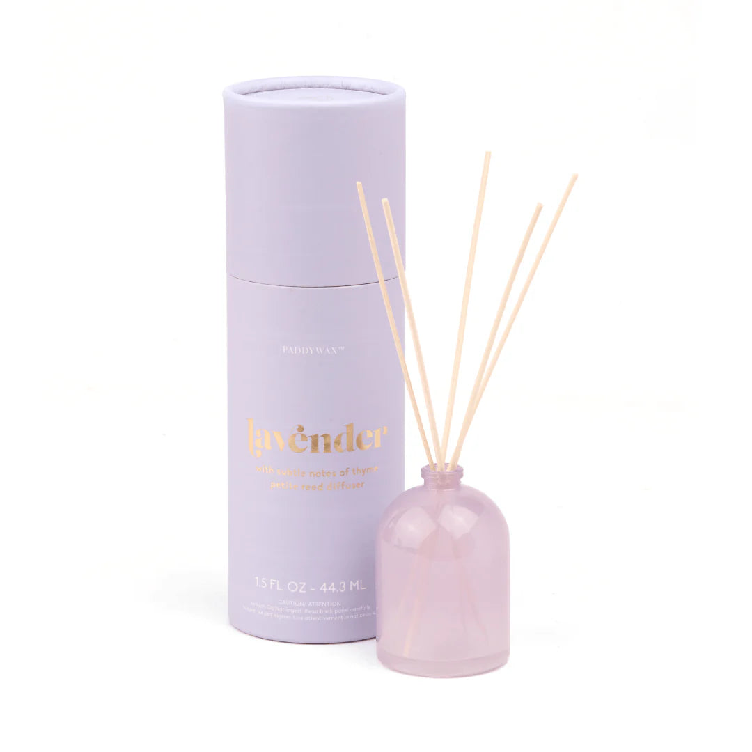 Lavender diffuser set with bottle and cylindrical container on a white background
