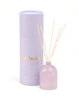 Lavender diffuser set with bottle and cylindrical container on a white background