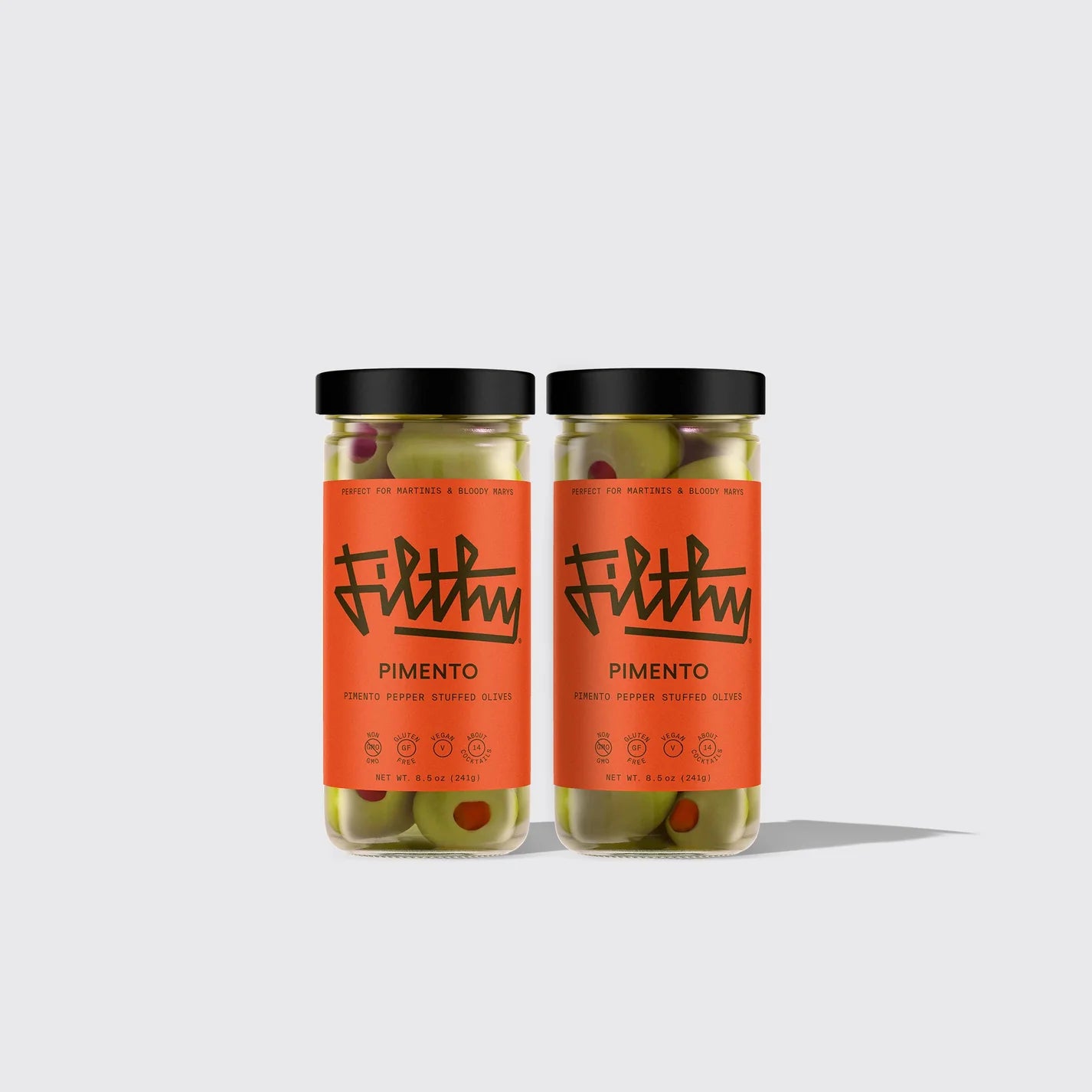 Two jars of Pimento Pepper Stuffed Olives on white background
