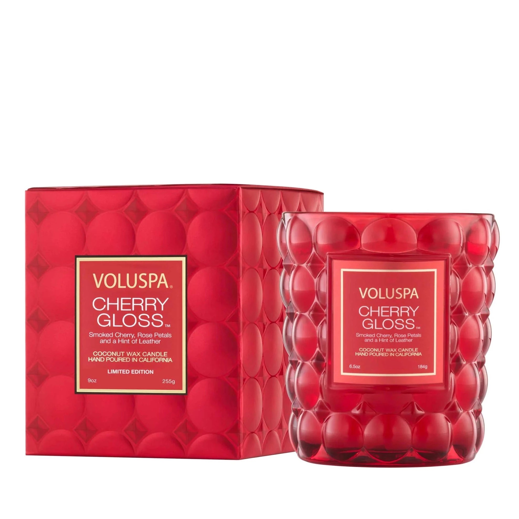 Red box with red bubbly candle next to it. Candle has white text