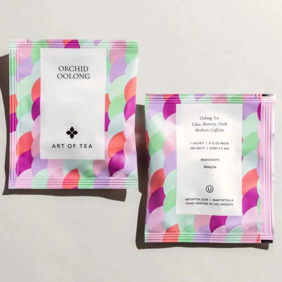 pastel colored tea sachet with. varies hues of purple, blue & green