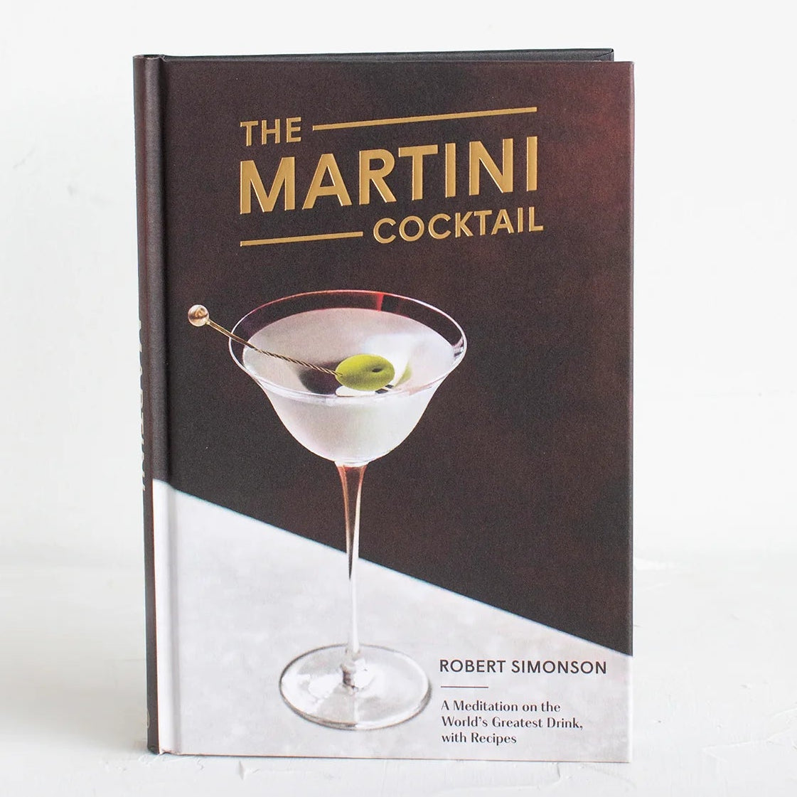 Book titled 'The Martini Cocktail' by Robert Simonson on a white background