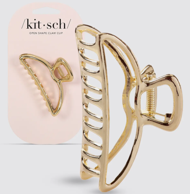 KITSCH gold hair clip with pink packaging that reads "Open shape claw clip"