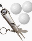 SILVER GOLF TOOL NEXT TO THREE WHITE GOLF BALLS