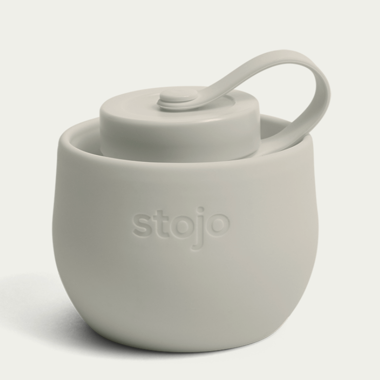 collapsed oat stojo bottle on white background 