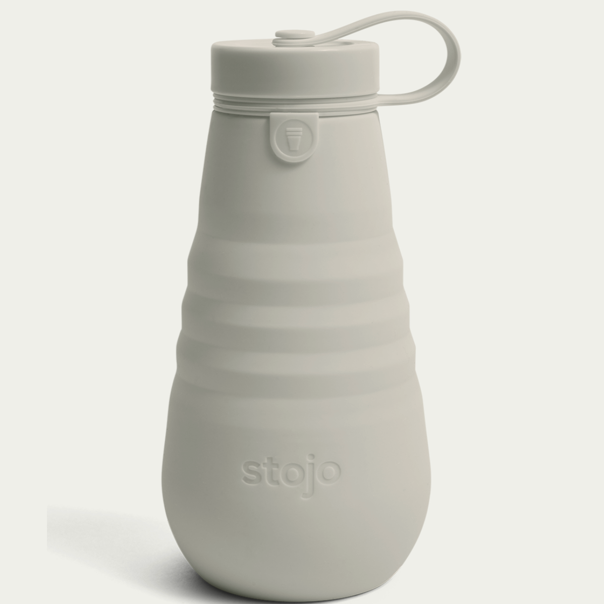 oat colored stojo bottle on white background