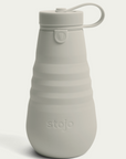 oat colored stojo bottle on white background