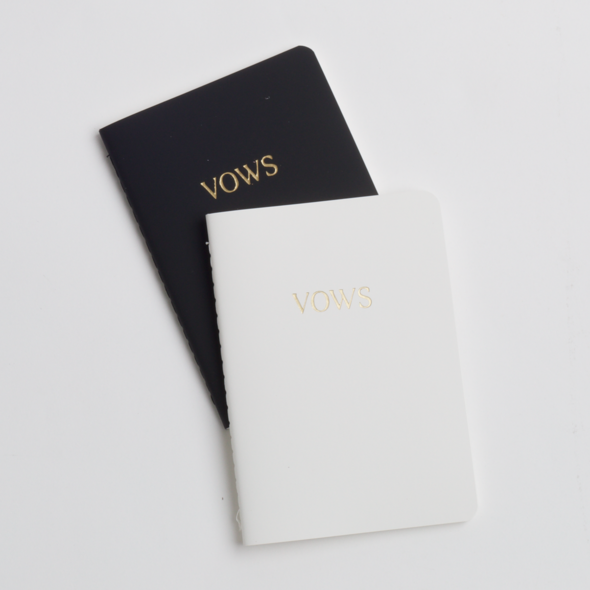black & white pocket notebooks with 'VOWS' embossed on them in gold