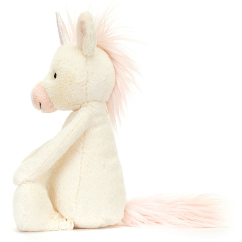 The unicorn is side facing on a white background