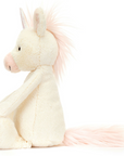 The unicorn is side facing on a white background