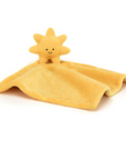 yellow sunshine blanket with smiley face on it behind white background