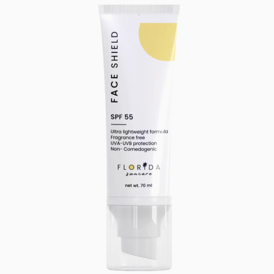 Face sunscreen product displayed with spf 55. The packaging is white with a yellow sun in the corner. It describes that the product is fragrance free