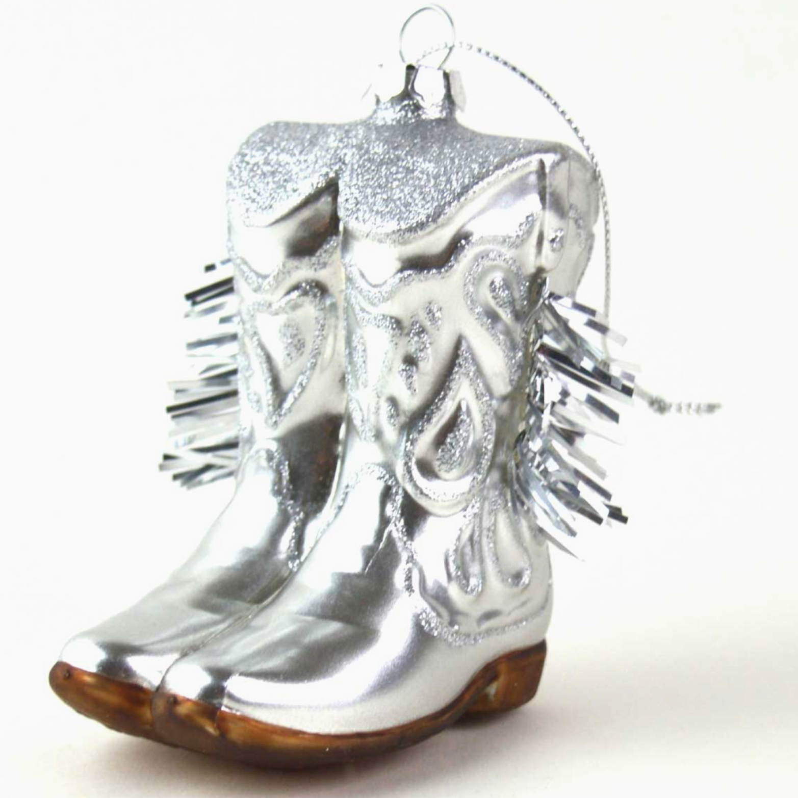 metallic glass cowboy boot ornament with brown bottoms on white background 