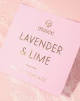 light lavendar packaging of musee 6 oz lavendar & lime bath salt soak in front of light pink background with visible salt. 