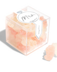 sugarfina clear box with MRS sticker on it in white and silver and inside of clear box is light pink beige peach gummies shaped like bears on white background 