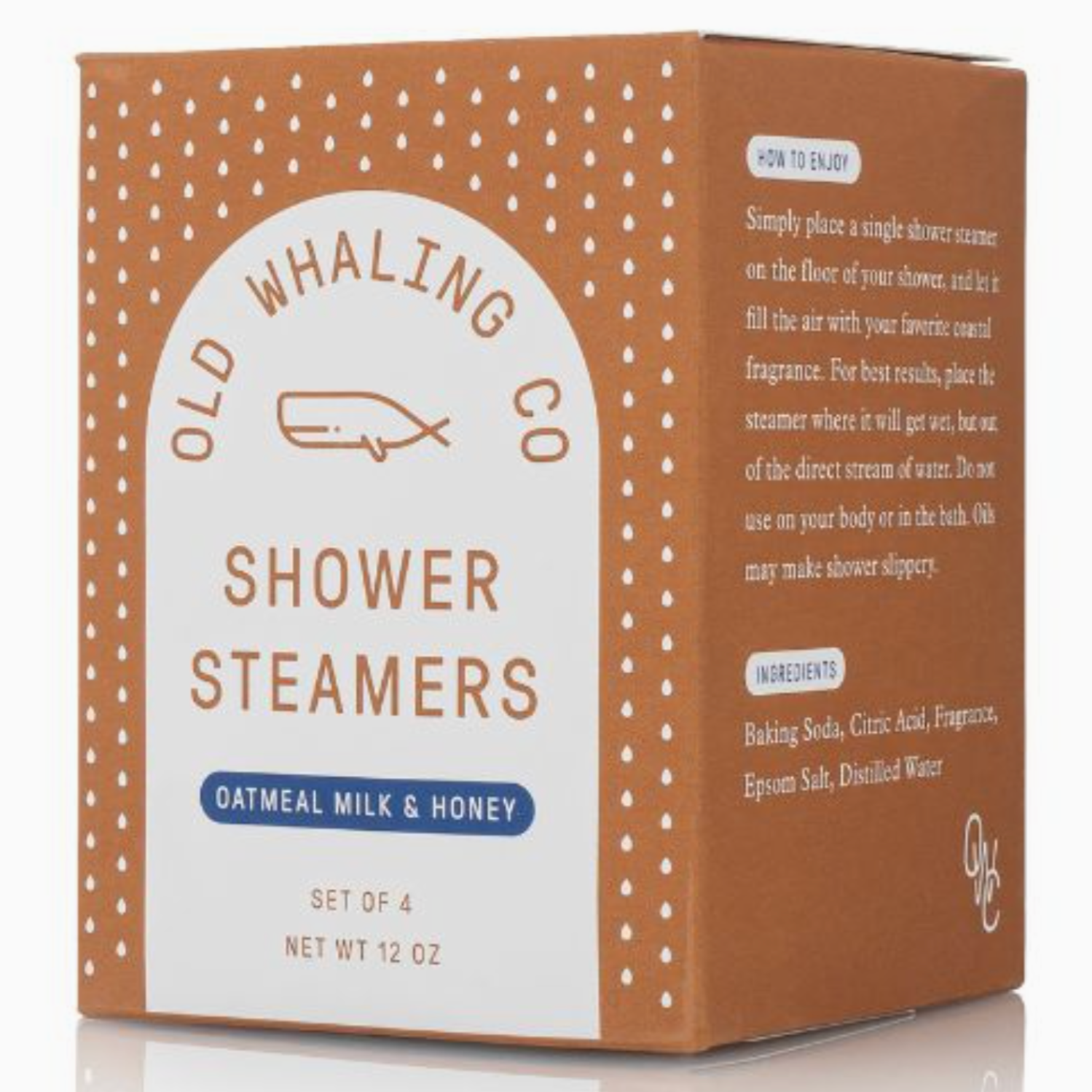 The image shows a brown box labeled "Old Whaling Co. Shower Steamers" with the scent "Oatmeal Milk & Honey." The packaging design features white polka dots and text describing how to use the steamers, which are intended for aromatherapy during showers. The set contains four shower steamers, and the ingredients listed include baking soda, citric acid, fragrance, Epsom salt, and distilled water.