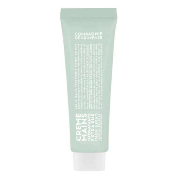 A single green tube of Compagnie de Provence hand cream, with a clean, minimalistic design and white text on the packaging, set against a plain white background.