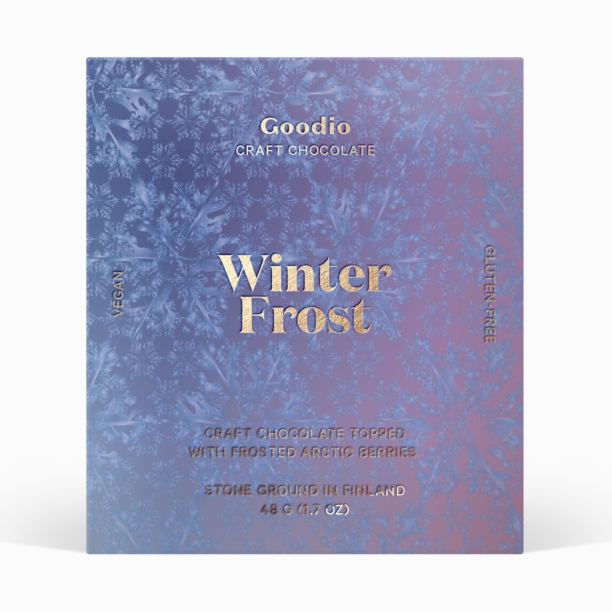 Packaging of a product called "Goodio Craft Chocolate." The packaging has a winter-themed design with snowflakes, and the text prominently reads "Winter Frost." It states the product is "Craft Chocolate Topped with Frosted Arctic Berries." It also mentions being vegan, gluten-free, stone ground in Finland, and the weight is 48 g (1.7 oz).






