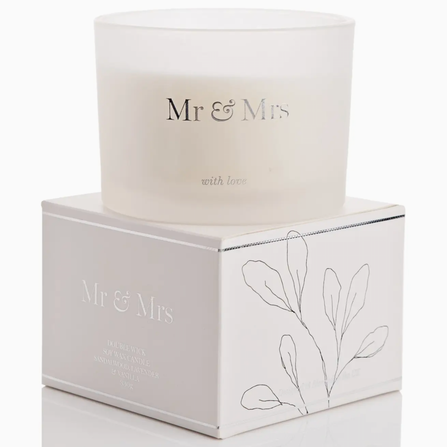 MR AND MRS CANDLE WITH LOVE SITTING ON TOP OF THE BOX IT COMES IN, THE BOX IS WHITE WITH SILVER AND BLACK DECALS
